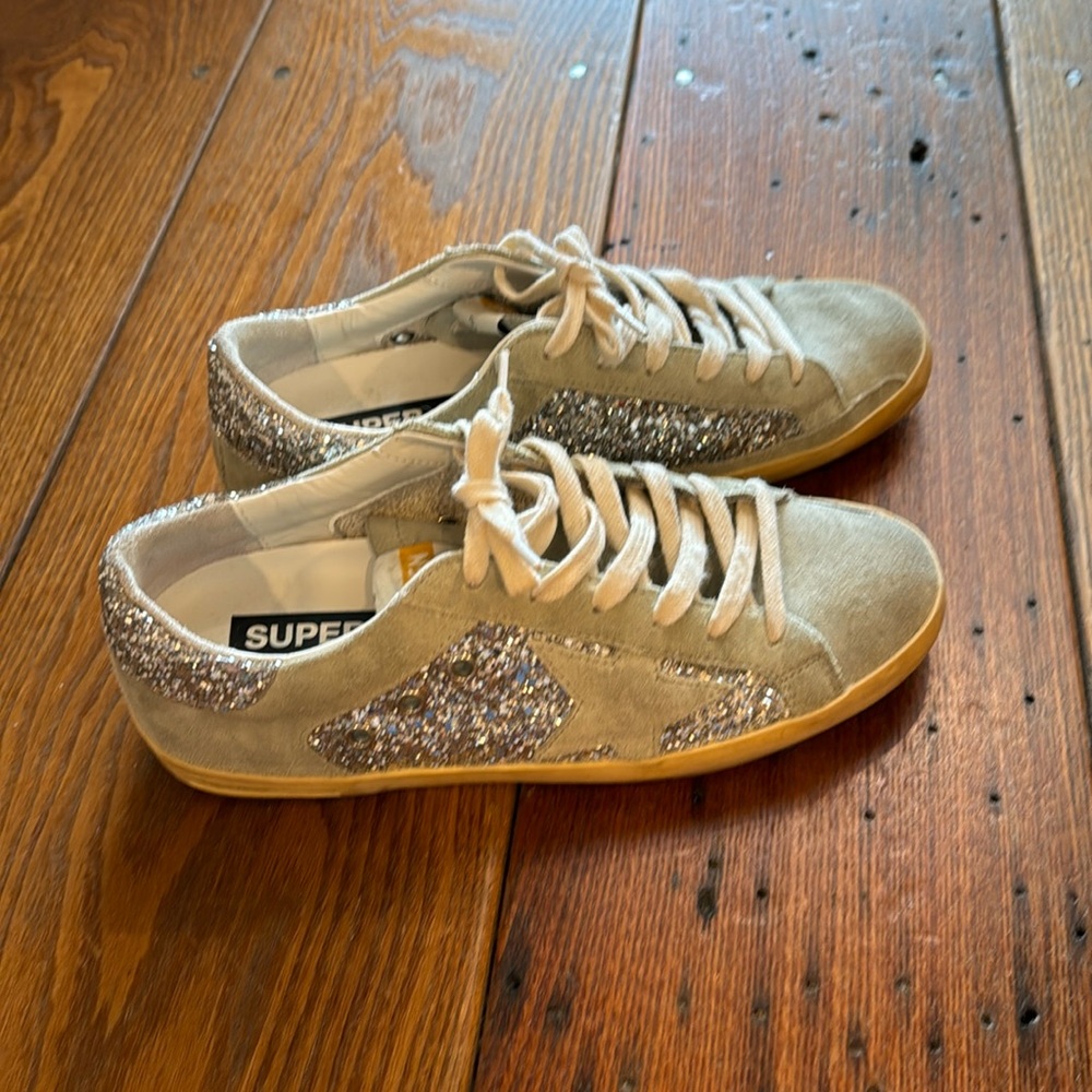 super-star sneakers size 38. Light blue suede color with silver sparkles.